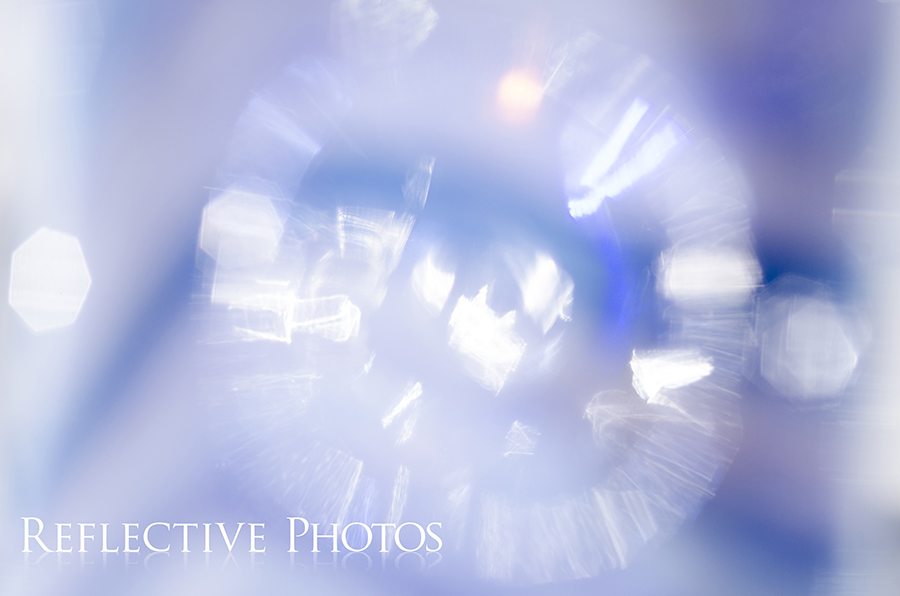 An out of focus reflection creates a bursting effect and beautiful bokeh.